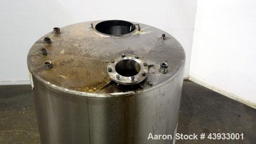 Used Tank, 1050 Gallons, 304 Stainless Steel, Vertical.  Approximately 62” diameter x 82” straight side.  Flat top, sloped bottom.  Off-center top entering Lightnin agitator, model N33G-150.  1-1/2” ...