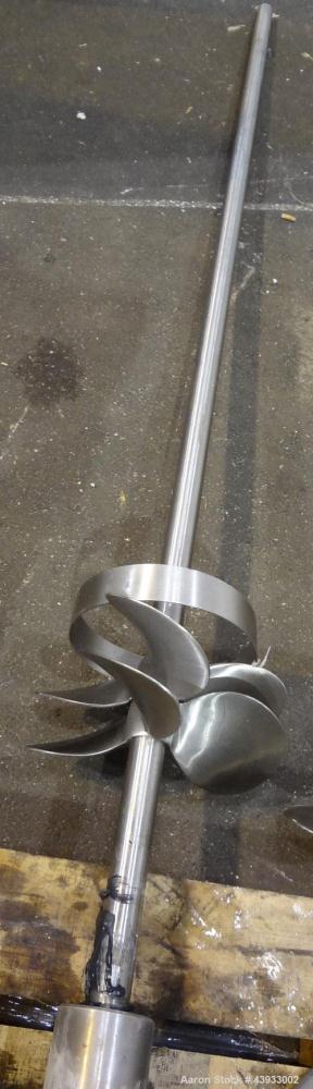 Used Tank, 1050 Gallon, 304 Stainless Steel, Vertical.  Approximately 62” diameter x 82” straight side.  Dished top, sloped bottom.  Off-center top entering Lightnin agitator, model N33G-150.  1-1/2”...