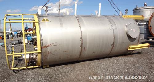 Used Tank, 4000 Gallon, 304 Stainless Steel, Vertical.  Approximately 82" diameter x 180" straight side, flat welded top, dished bottom.  Top mounted Eastern agitator, model APDS-3M. Approximately 2-...