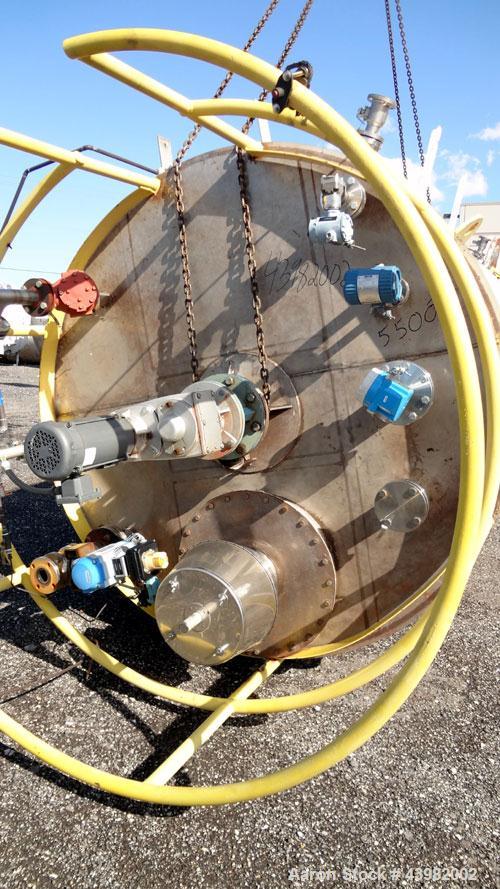 Used Tank, 4000 Gallon, 304 Stainless Steel, Vertical.  Approximately 82" diameter x 180" straight side, flat welded top, dished bottom.  Top mounted Eastern agitator, model APDS-3M. Approximately 2-...