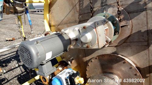 Used Tank, 4000 Gallon, 304 Stainless Steel, Vertical.  Approximately 82" diameter x 180" straight side, flat welded top, dished bottom.  Top mounted Eastern agitator, model APDS-3M. Approximately 2-...