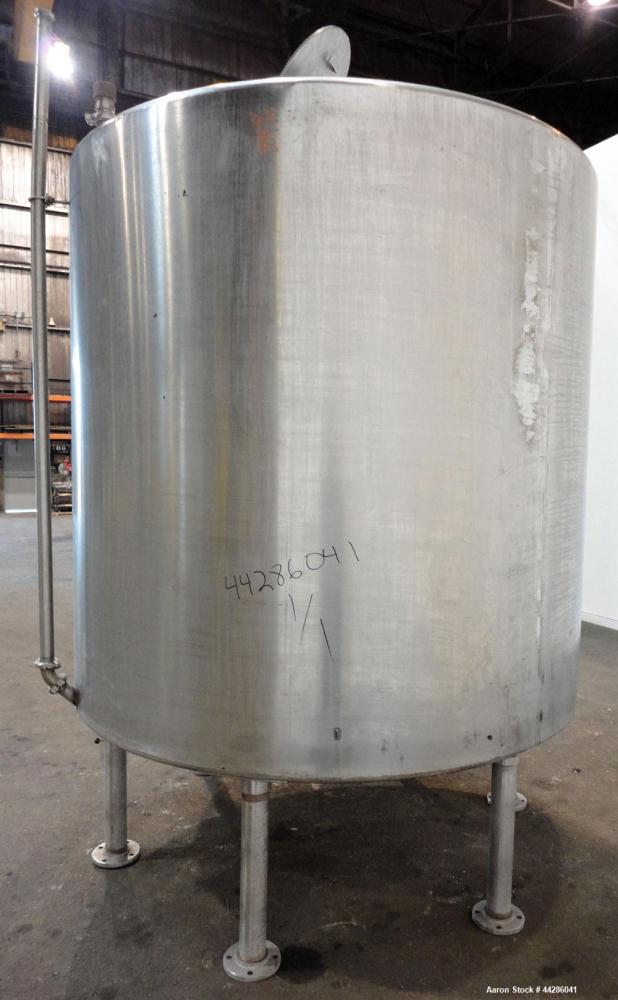 Used Tank, 2000 Gallon, 304 Stainless Steel, Vertical. 84" Diameter x 80" straight side. Dished top, coned bottom. Openings top (2) 2”, 4”, 18” man way with cover, side 2”. 3" Center bottom outlet. M...