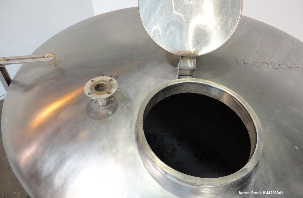 Used Tank, 2000 Gallon, 304 Stainless Steel, Vertical. 84" Diameter x 80" straight side. Dished top, coned bottom. Openings top (2) 2”, 4”, 18” man way with cover, side 2”. 3" Center bottom outlet. M...