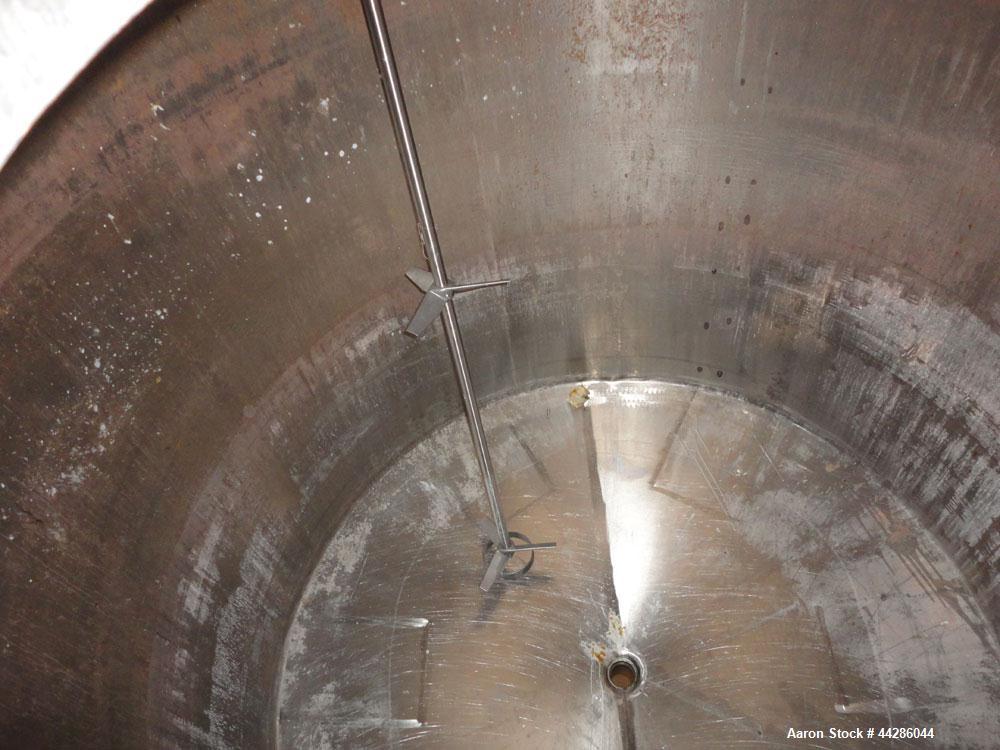 Used Tank, 2000 Gallon, 304 Stainless Steel, Vertical. 84" Diameter x 80" straight side. Dished top, coned bottom. Off center air operated Lightnin agitator, model XJAC-100, serial# R0133919201. 1-1/...
