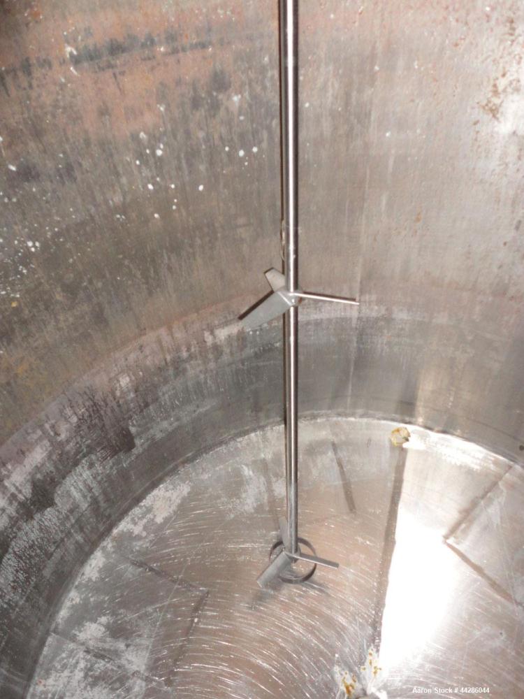 Used Tank, 2000 Gallon, 304 Stainless Steel, Vertical. 84" Diameter x 80" straight side. Dished top, coned bottom. Off center air operated Lightnin agitator, model XJAC-100, serial# R0133919201. 1-1/...