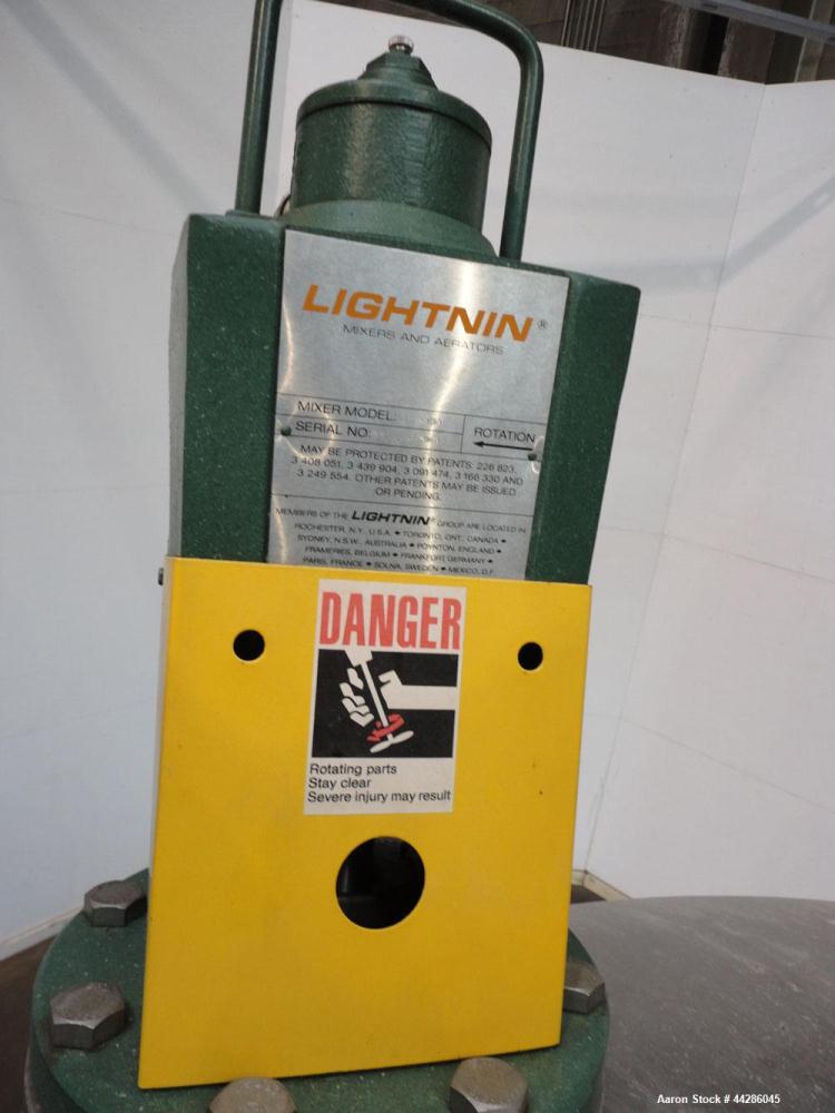 Used Tank, 2000 Gallon, 304 Stainless Steel, Vertical. 84" Diameter x 80" straight side. Dished top, coned bottom. Off center air operated Lightnin agitator, model XJAC-100, serial# 95/E49459-02. 1-1...