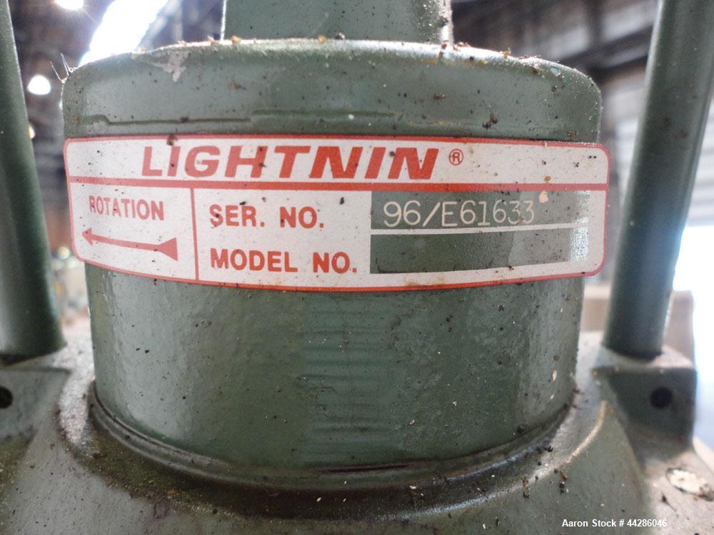 Used Tank, 2000 Gallon, 304 Stainless Steel, Vertical. 84" Diameter x 80" straight side. Dished top, coned bottom. Off center air operated Lightnin agitator, serial# 95/E61633. 1-1/2” Diameter shaft ...