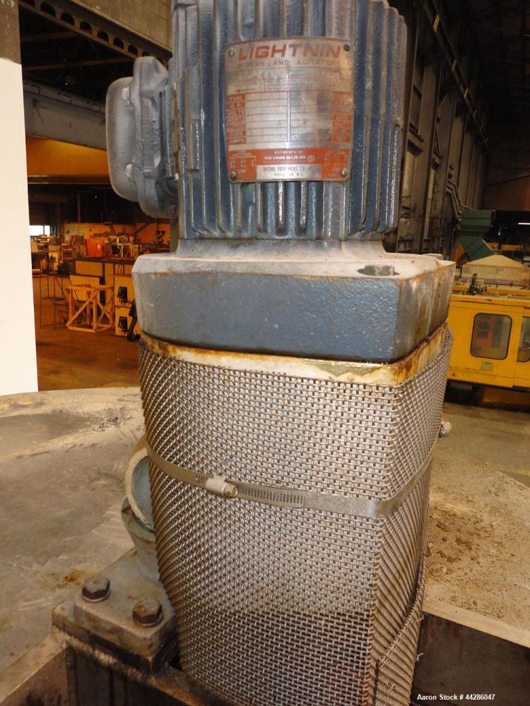 Used Tank, 1500 Gallon, 321 Stainless Steel, Vertical. 74" Diameter x 84" straight side. Flat top, coned bottom. Off center Lightnin agitator, model ND-4A, serial# 6917791. 1-1/2" Diameter shaft with...