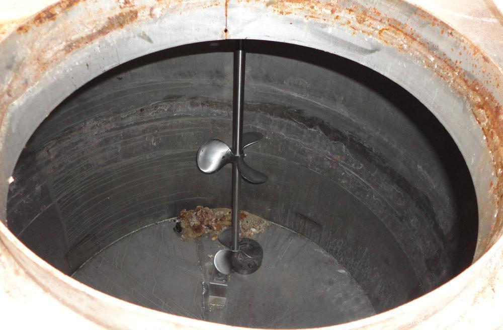 Used Tank, 1500 Gallon, 321 Stainless Steel, Vertical. 74" Diameter x 84" straight side. Flat top, coned bottom. Off center Lightnin agitator, model ND-4A, serial# 6917791. 1-1/2" Diameter shaft with...