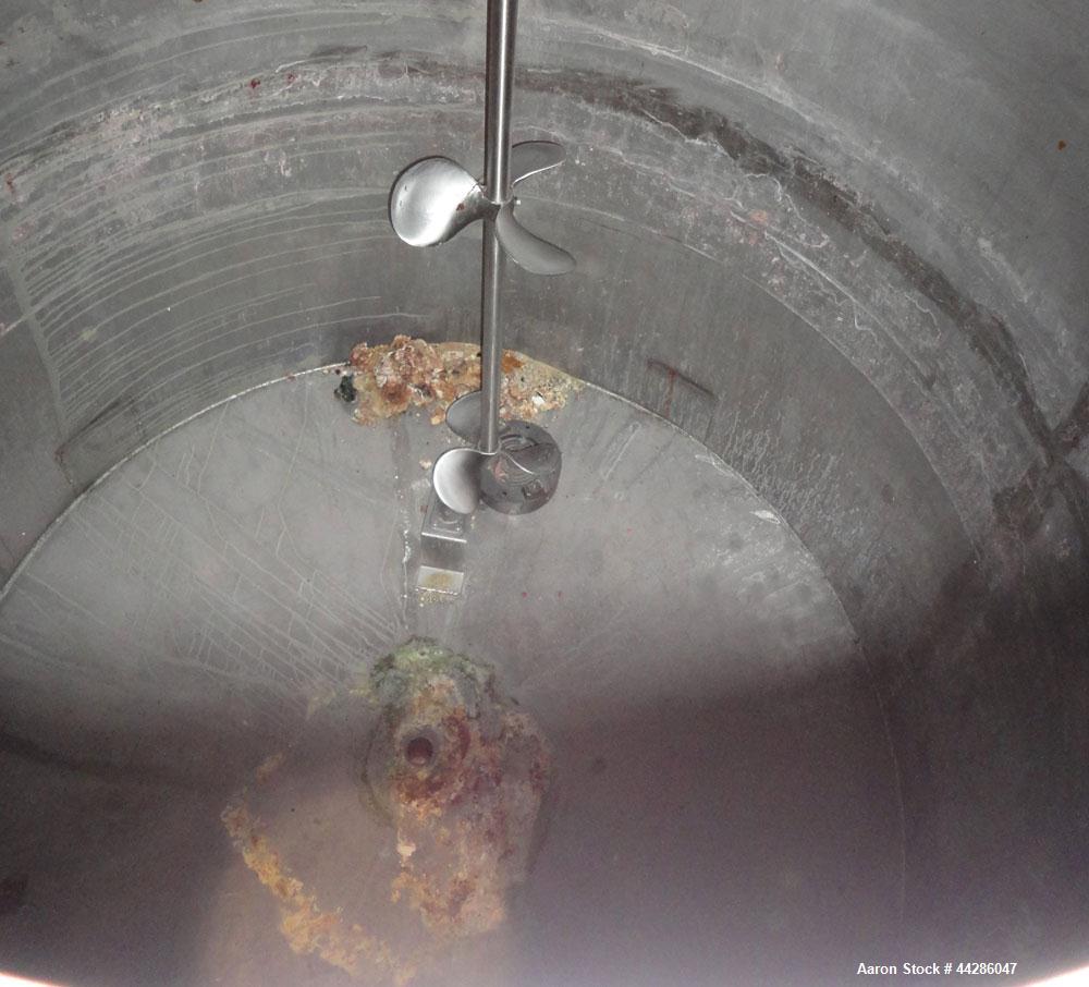 Used Tank, 1500 Gallon, 321 Stainless Steel, Vertical. 74" Diameter x 84" straight side. Flat top, coned bottom. Off center Lightnin agitator, model ND-4A, serial# 6917791. 1-1/2" Diameter shaft with...