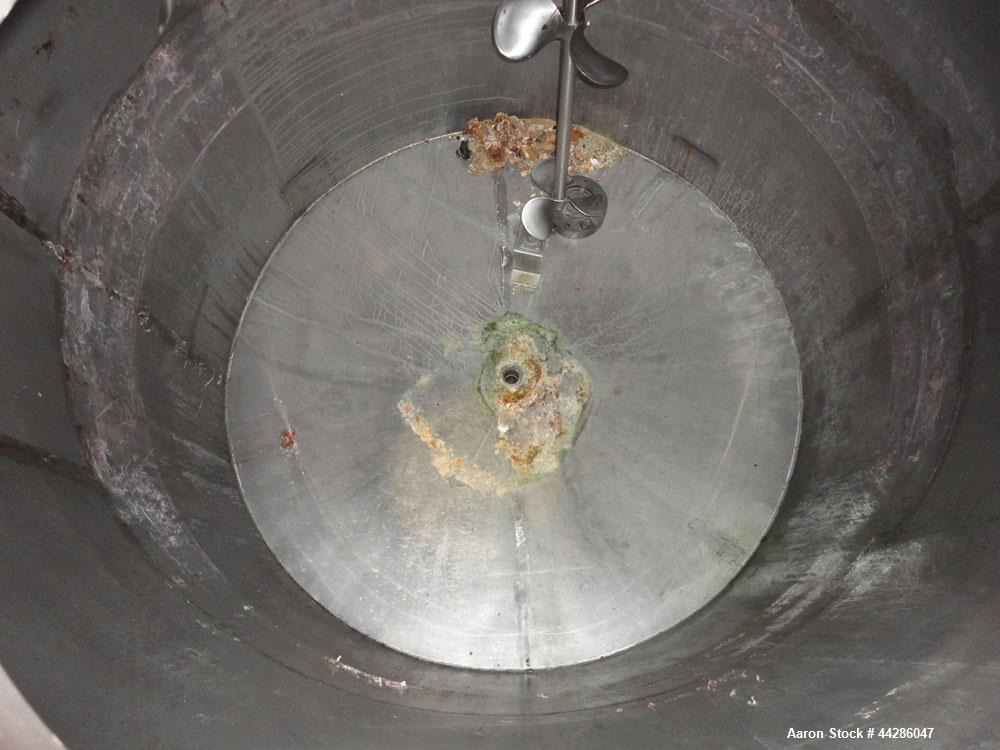 Used Tank, 1500 Gallon, 321 Stainless Steel, Vertical. 74" Diameter x 84" straight side. Flat top, coned bottom. Off center Lightnin agitator, model ND-4A, serial# 6917791. 1-1/2" Diameter shaft with...