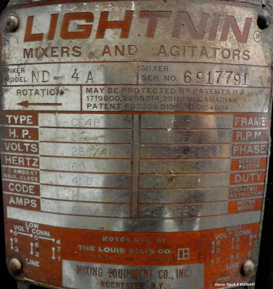 Used Tank, 1500 Gallon, 321 Stainless Steel, Vertical. 74" Diameter x 84" straight side. Flat top, coned bottom. Off center Lightnin agitator, model ND-4A, serial# 6917791. 1-1/2" Diameter shaft with...