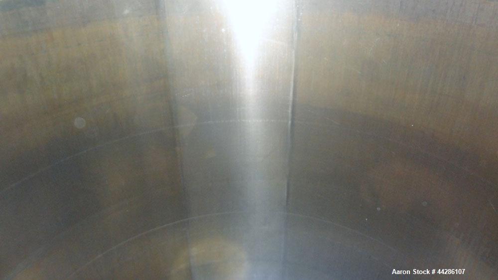 Used- Tank, 2000 Gallon, 304 Stainless Steel, Vertical. 84" Diameter x 80" straight side. Dished top, coned bottom. Openings...