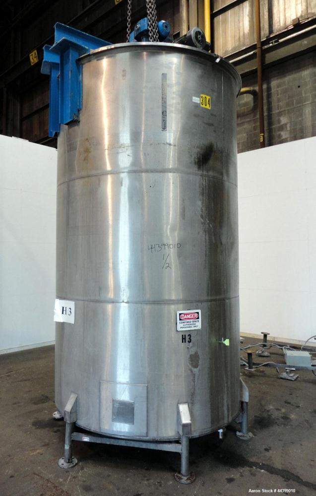 Used Tank, 3400 Gallon, 304 Stainless Steel, Vertical. Approximate 84” diameter x 143” straight side, flat top with 1/3 hinged cover, sloped bottom. Fixed carbon steel agitator bridge with a top ente...