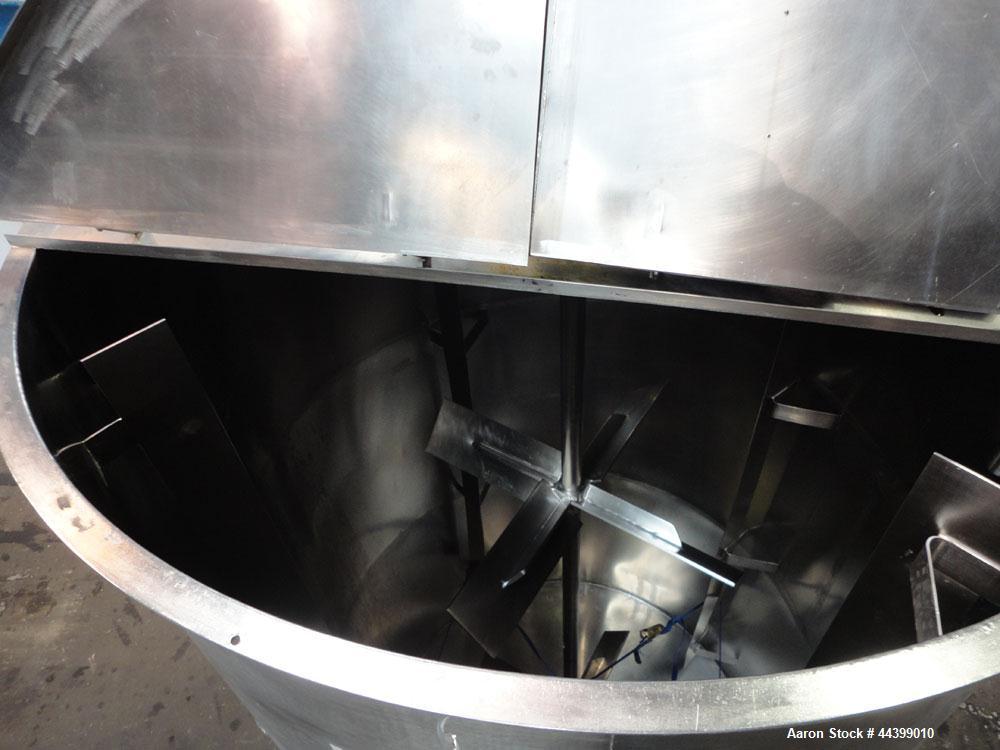 Used Tank, 3400 Gallon, 304 Stainless Steel, Vertical. Approximate 84” diameter x 143” straight side, flat top with 1/3 hinged cover, sloped bottom. Fixed carbon steel agitator bridge with a top ente...