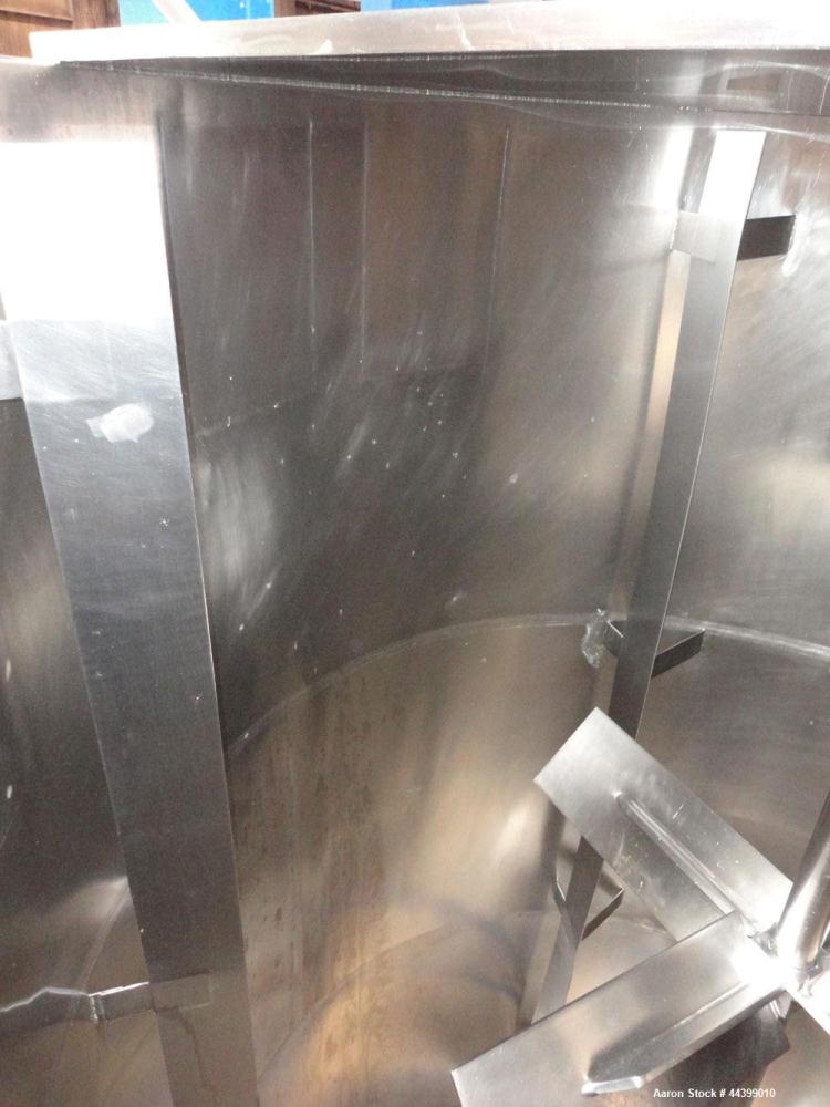 Used Tank, 3400 Gallon, 304 Stainless Steel, Vertical. Approximate 84” diameter x 143” straight side, flat top with 1/3 hinged cover, sloped bottom. Fixed carbon steel agitator bridge with a top ente...