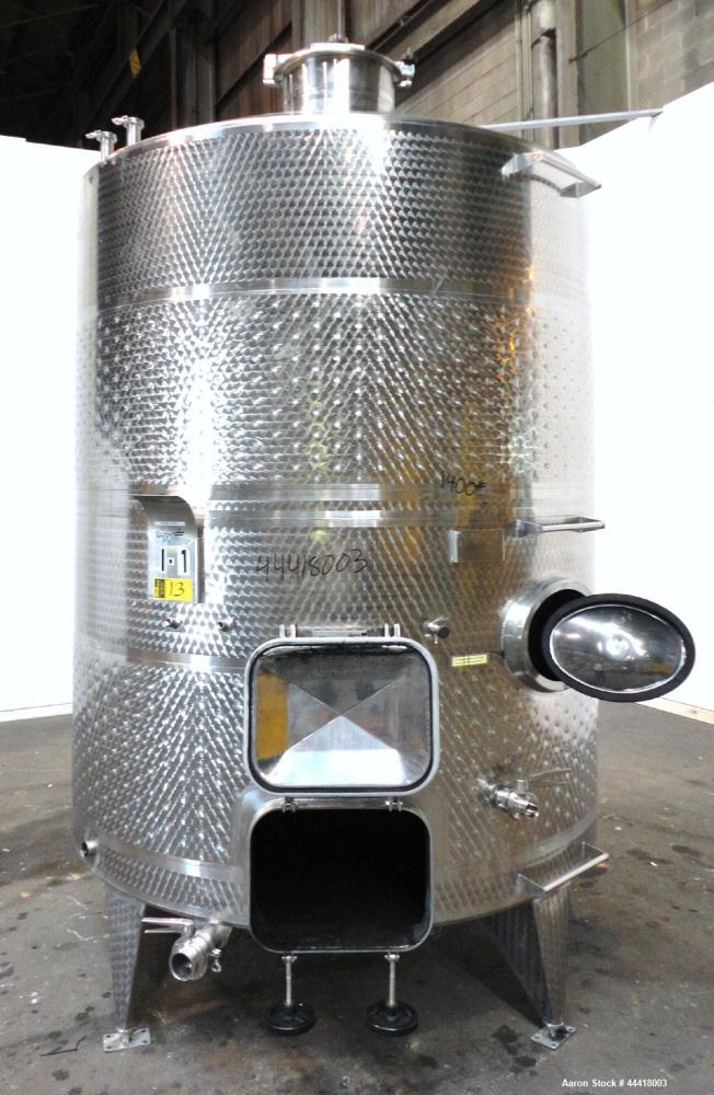 Used Vinquip Jacketed Beverage Tank,  2284 Gallon, 304 Stainless Steel, Vertical. Approximately 83” diameter x 97-1/2” straight side, off center coned top, sloped bottom.  (1) 24” Wide bottom sidewal...