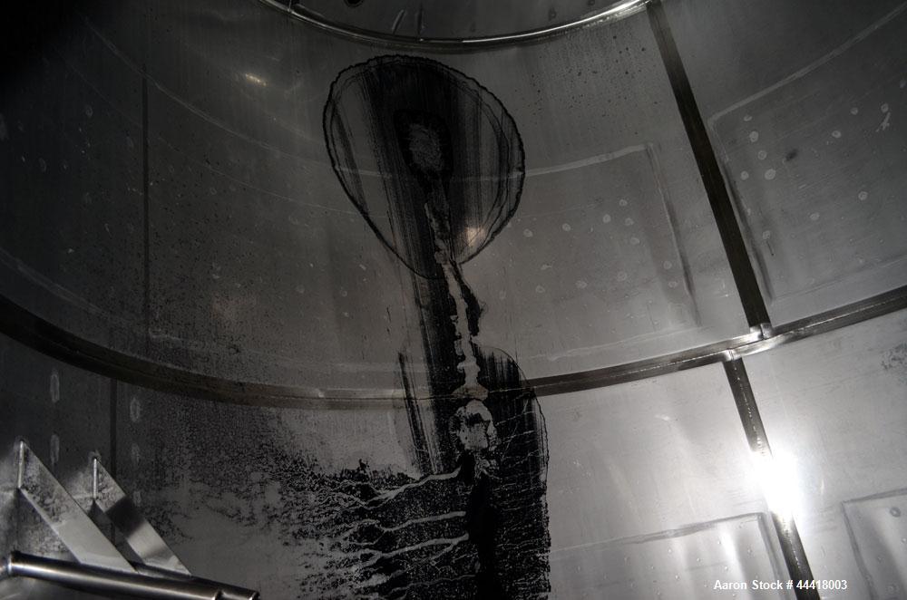Used Vinquip Jacketed Beverage Tank,  2284 Gallon, 304 Stainless Steel, Vertical. Approximately 83” diameter x 97-1/2” straight side, off center coned top, sloped bottom.  (1) 24” Wide bottom sidewal...