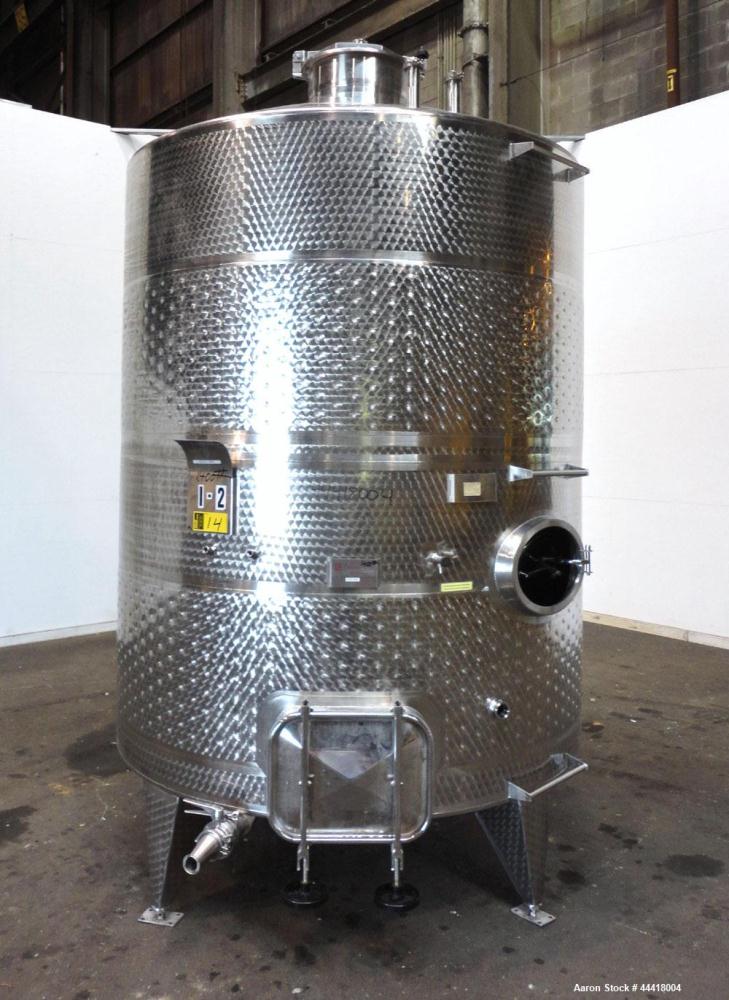 Used Vinquip Jacketed Beverage Tank,  2284 Gallon, 304 Stainless Steel, Vertical. Approximately 83” diameter x 97-1/2” straight side, off center coned top, sloped bottom. (1) 24” Wide bottom sidewall...