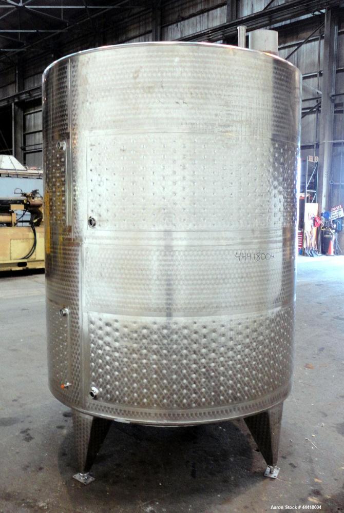 Used Vinquip Jacketed Beverage Tank,  2284 Gallon, 304 Stainless Steel, Vertical. Approximately 83” diameter x 97-1/2” straight side, off center coned top, sloped bottom. (1) 24” Wide bottom sidewall...
