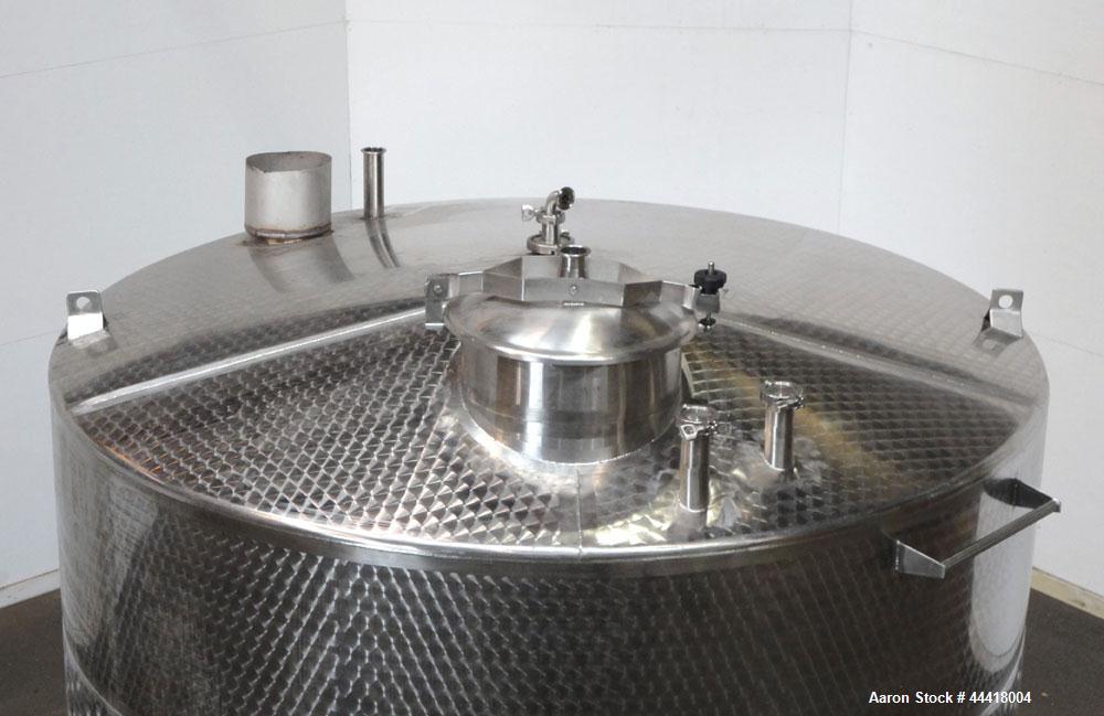 Used Vinquip Jacketed Beverage Tank,  2284 Gallon, 304 Stainless Steel, Vertical. Approximately 83” diameter x 97-1/2” straight side, off center coned top, sloped bottom. (1) 24” Wide bottom sidewall...
