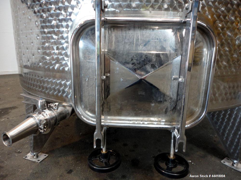Used Vinquip Jacketed Beverage Tank,  2284 Gallon, 304 Stainless Steel, Vertical. Approximately 83” diameter x 97-1/2” straight side, off center coned top, sloped bottom. (1) 24” Wide bottom sidewall...
