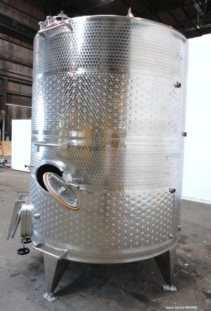 Used Vinquip Jacketed Beverage Tank,  2284 Gallon, 304 Stainless Steel, Vertical. Approximately 83” diameter x 97-1/2” straight side, off center coned top, sloped bottom. (1) 24” Wide bottom sidewall...