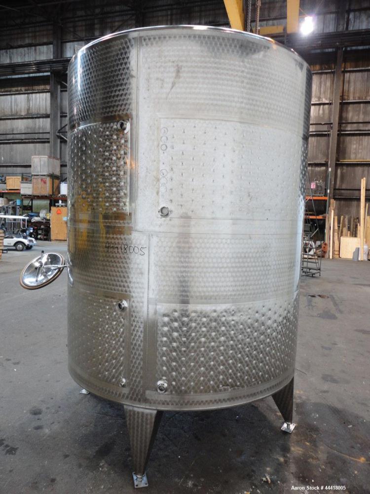 Used Vinquip Jacketed Beverage Tank,  2284 Gallon, 304 Stainless Steel, Vertical. Approximately 83” diameter x 97-1/2” straight side, off center coned top, sloped bottom. (1) 24” Wide bottom sidewall...