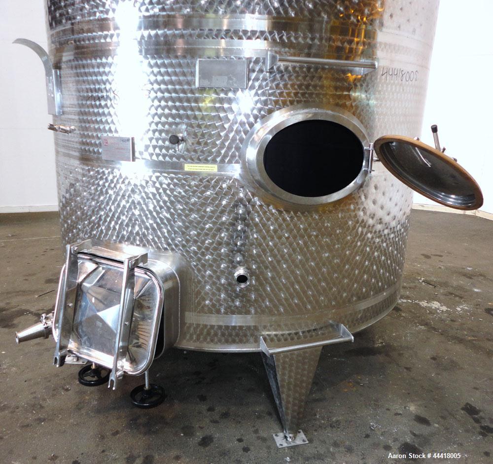 Used Vinquip Jacketed Beverage Tank,  2284 Gallon, 304 Stainless Steel, Vertical. Approximately 83” diameter x 97-1/2” straight side, off center coned top, sloped bottom. (1) 24” Wide bottom sidewall...