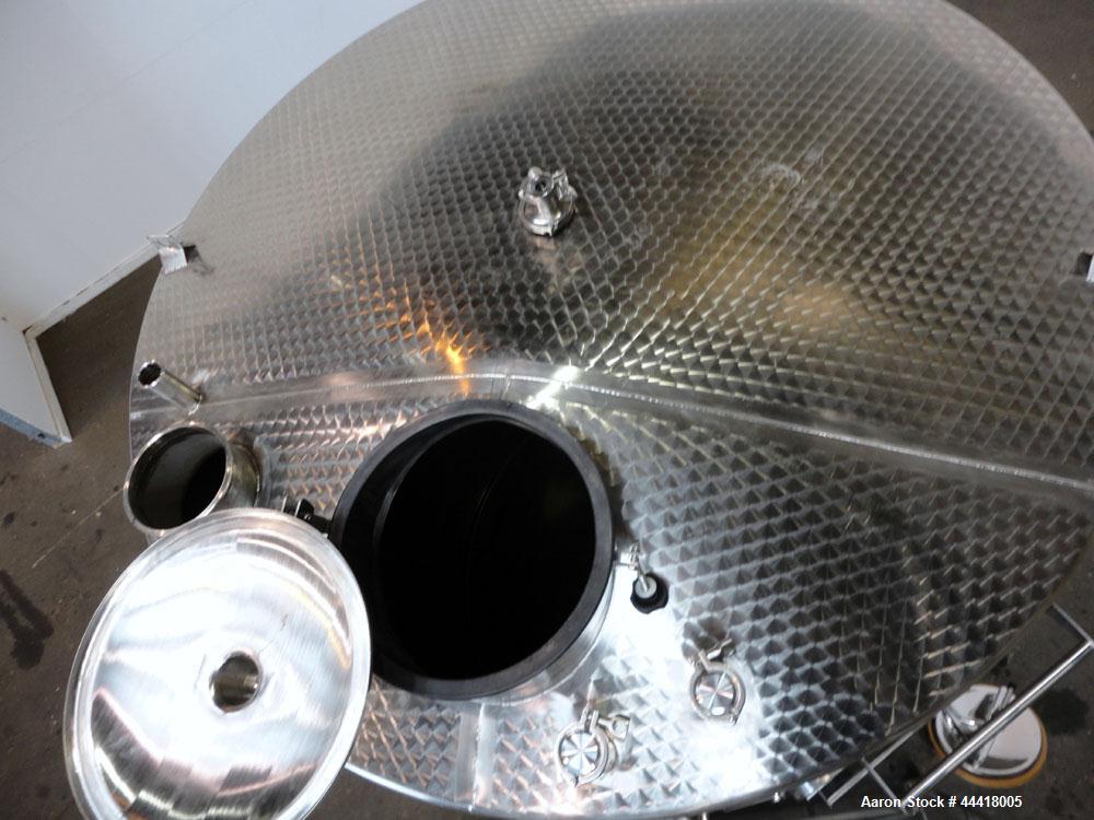 Used Vinquip Jacketed Beverage Tank,  2284 Gallon, 304 Stainless Steel, Vertical. Approximately 83” diameter x 97-1/2” straight side, off center coned top, sloped bottom. (1) 24” Wide bottom sidewall...