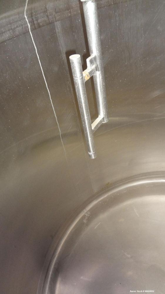 Used Tank, 1000 Gallon, 304 Stainless Steel, Vertical.  Approximately 72" diameter x 60" straight side, dished top, sloped bottom.  Fixed stainless steel agitator mount.  Approximately 2" diameter sh...