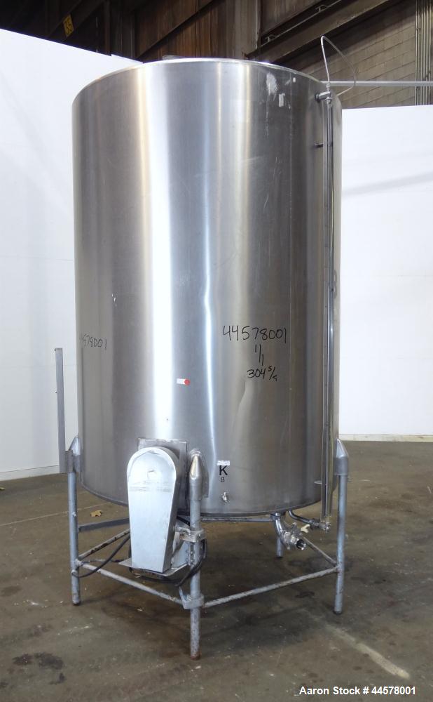 Used Tank, 1000 Gallon, 304 Stainless Steel, Vertical. 60” Diameter x 82” straight side, flat welded top, sloped bottom. Side Bottom entering agitator with a 3 blade prop, driven by a 3hp, 3/60/230/4...