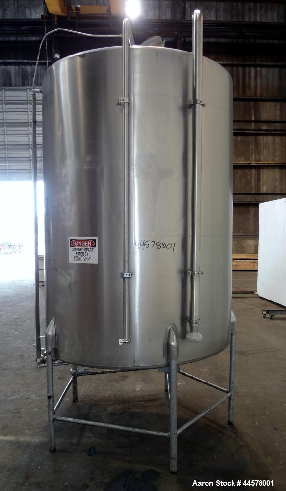 Used Tank, 1000 Gallon, 304 Stainless Steel, Vertical. 60” Diameter x 82” straight side, flat welded top, sloped bottom. Side Bottom entering agitator with a 3 blade prop, driven by a 3hp, 3/60/230/4...