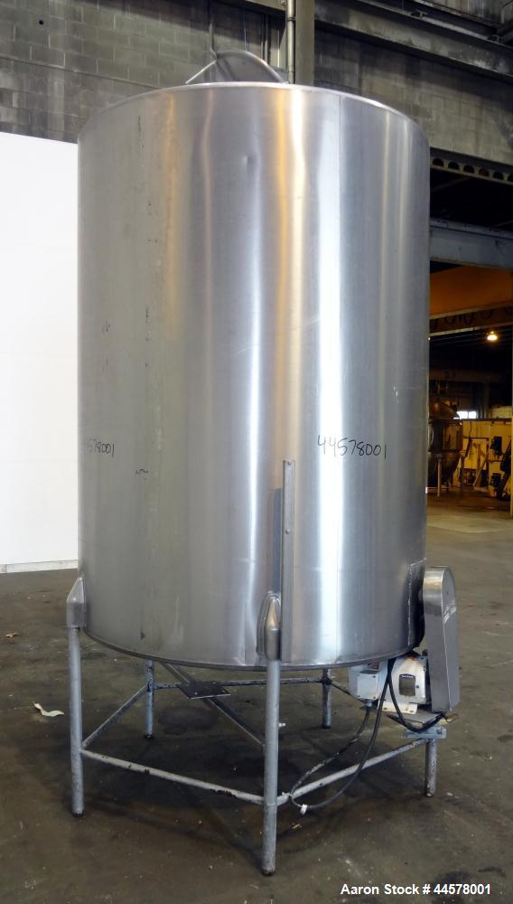 Used Tank, 1000 Gallon, 304 Stainless Steel, Vertical. 60” Diameter x 82” straight side, flat welded top, sloped bottom. Side Bottom entering agitator with a 3 blade prop, driven by a 3hp, 3/60/230/4...