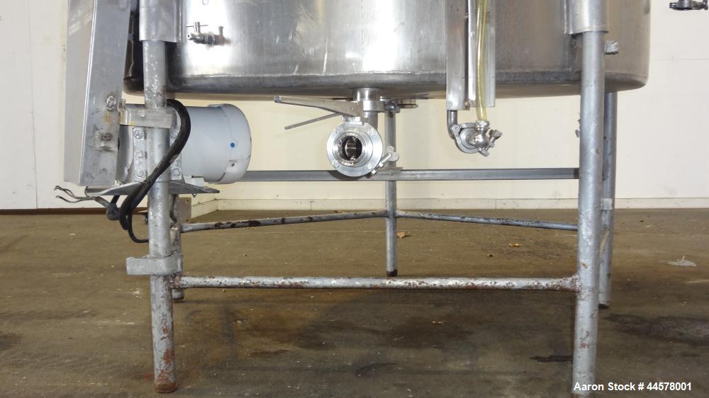 Used Tank, 1000 Gallon, 304 Stainless Steel, Vertical. 60” Diameter x 82” straight side, flat welded top, sloped bottom. Side Bottom entering agitator with a 3 blade prop, driven by a 3hp, 3/60/230/4...
