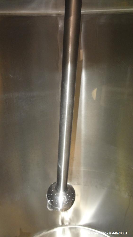Used Tank, 1000 Gallon, 304 Stainless Steel, Vertical. 60” Diameter x 82” straight side, flat welded top, sloped bottom. Side Bottom entering agitator with a 3 blade prop, driven by a 3hp, 3/60/230/4...