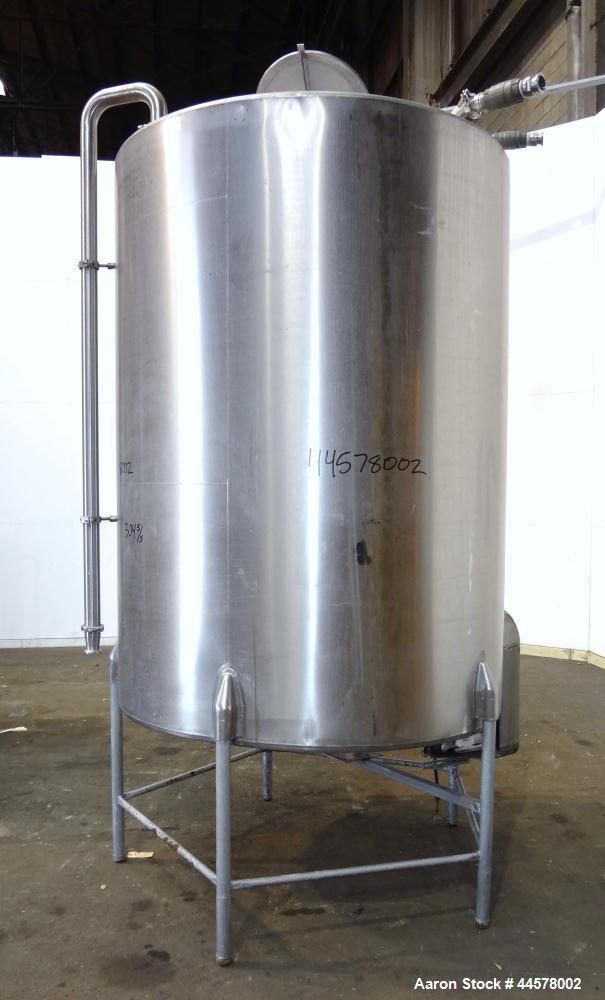 Used Tank, 1000 Gallon, 304 Stainless Steel, Vertical. 60” Diameter x 82” straight side, flat welded top, sloped bottom. Side Bottom entering agitator with a 3 blade prop, driven by a 2hp, 3/60/208-2...