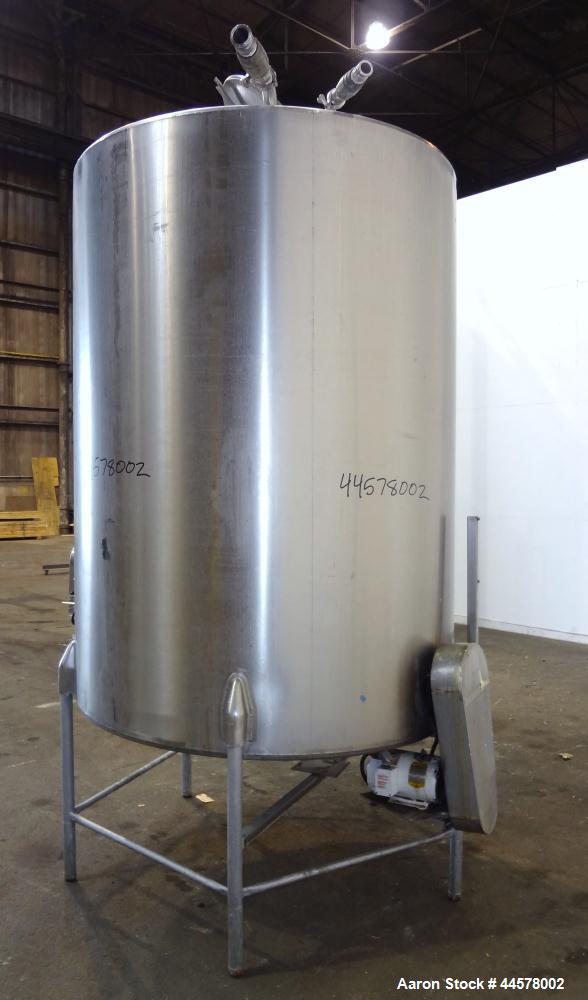 Used Tank, 1000 Gallon, 304 Stainless Steel, Vertical. 60” Diameter x 82” straight side, flat welded top, sloped bottom. Side Bottom entering agitator with a 3 blade prop, driven by a 2hp, 3/60/208-2...