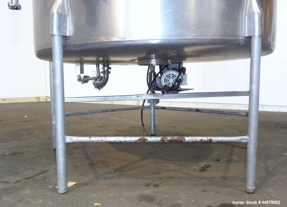 Used Tank, 1000 Gallon, 304 Stainless Steel, Vertical. 60” Diameter x 82” straight side, flat welded top, sloped bottom. Side Bottom entering agitator with a 3 blade prop, driven by a 2hp, 3/60/208-2...