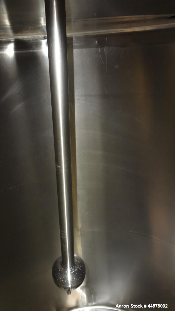 Used Tank, 1000 Gallon, 304 Stainless Steel, Vertical. 60” Diameter x 82” straight side, flat welded top, sloped bottom. Side Bottom entering agitator with a 3 blade prop, driven by a 2hp, 3/60/208-2...