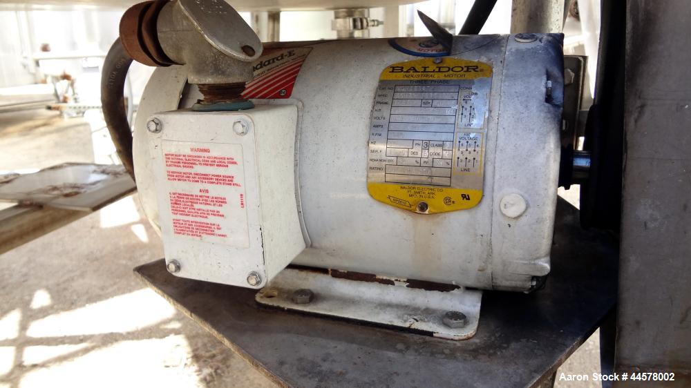 Used Tank, 1000 Gallon, 304 Stainless Steel, Vertical. 60” Diameter x 82” straight side, flat welded top, sloped bottom. Side Bottom entering agitator with a 3 blade prop, driven by a 2hp, 3/60/208-2...