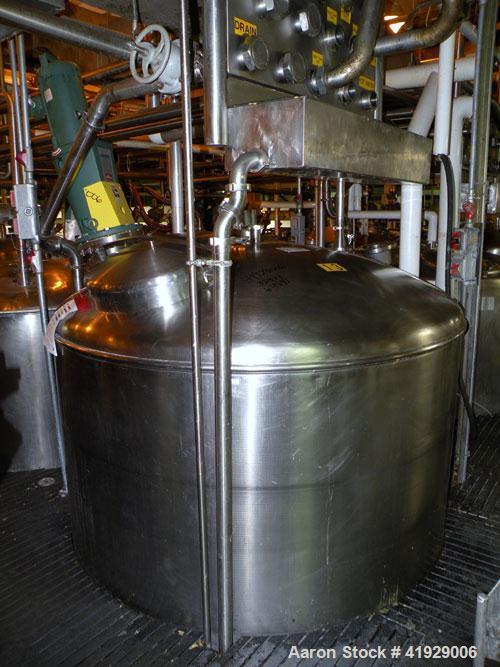 Used Norwalk Tank, 2000 Gallon,  stainless steel, vertical. 76" diameter x 106" straight side, dished top and bottom. Off center top entering angled Lightnin agitator, model XJC-350. 1-1/2" diameter ...