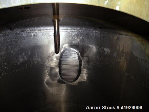 Used Norwalk Tank, 2000 Gallon,  stainless steel, vertical. 76" diameter x 106" straight side, dished top and bottom. Off center top entering angled Lightnin agitator, model XJC-350. 1-1/2" diameter ...