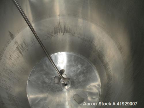 Used Norwalk Tank, 2000 Gallon, 316 Stainless Steel, Vertical. 76" diameter x 106" straight side, 304 stainless steel dished top, 316 dished bottom. Off center top entering angled Lightnin manual var...