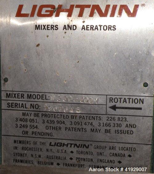 Used Norwalk Tank, 2000 Gallon, 316 Stainless Steel, Vertical. 76" diameter x 106" straight side, 304 stainless steel dished top, 316 dished bottom. Off center top entering angled Lightnin manual var...
