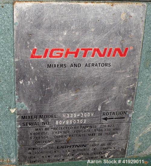 Used Norwalk Tank, 2000 Gallon,  stainless steel, vertical. 76" diameter x 106" straight side, dished top and bottom. Top side wall entering angled Lightnin manual variable speed agitator, model N33G...
