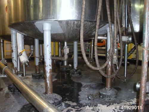 Used Norwalk Tank, 2000 Gallon,  stainless steel, vertical. 76" diameter x 106" straight side, dished top and bottom. Top side wall entering angled Lightnin manual variable speed agitator, model N33G...
