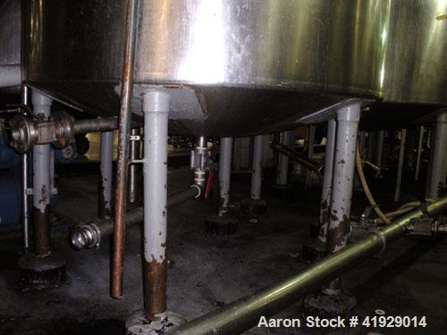 Used Norwalk Tank, 2000 Gallon,  stainless steel, vertical. 76" diameter x 106" straight side, dished top and bottom. Top side wall entering angled Lightnin manual variable speed agitator, model N33G...