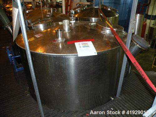 Used Norwalk Tank, 2000 Gallon,  Stainless Steel, Vertical. 76" diameter x 106" straight side, dished top and bottom. Openings top 4" tri-clamp, 4" vent, (2) 18" manway with cover, side 8" drive (cap...