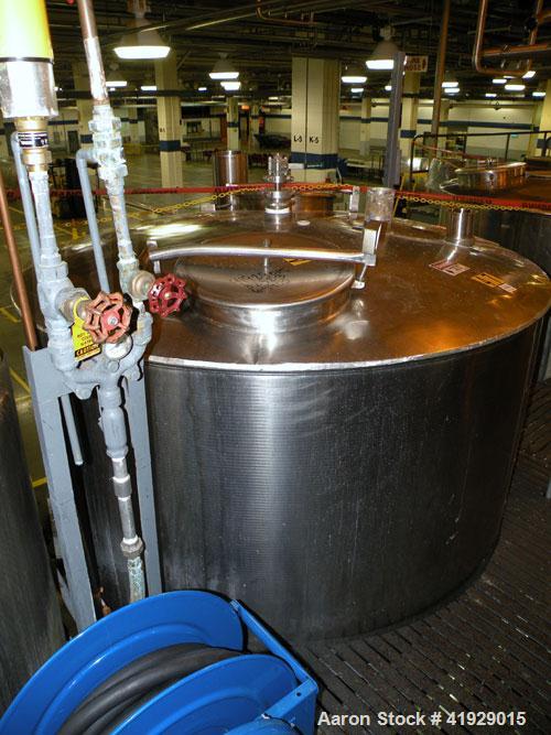 Used Norwalk Tank, 2000 Gallon,  Stainless Steel, Vertical. 76" diameter x 106" straight side, dished top and bottom. Openings top 4" tri-clamp, 4" vent, (2) 18" manway with cover, side 8" drive (cap...